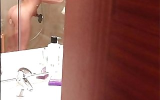 Pervert films blonde girl during orgasm in hotel shower